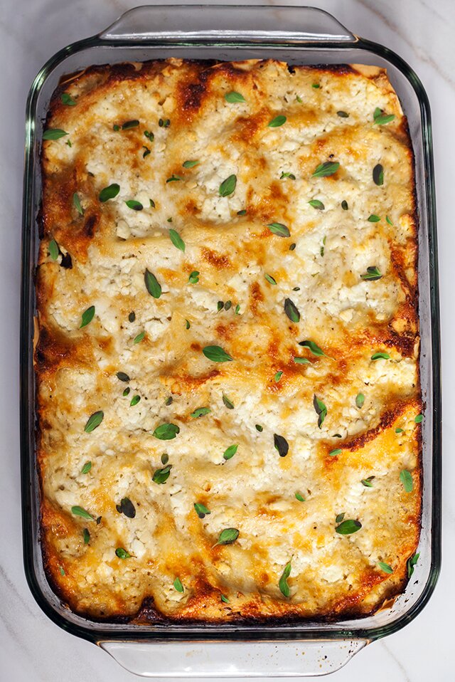 A feta bechamel, ground lamb, as el hangout, and dried apricots make this lasagna recipe extra special! | www.spachethespatula.com 