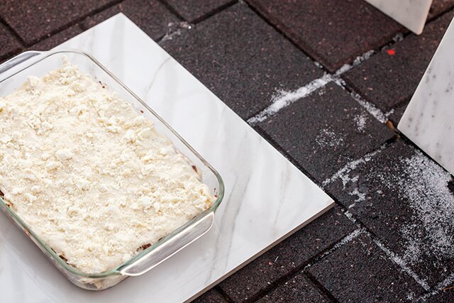 A feta bechamel, ground lamb, as el hangout, and dried apricots make this lasagna recipe extra special! | www.spachethespatula.com 