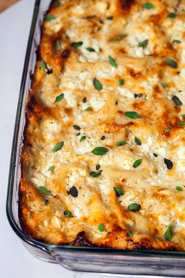 A feta bechamel, ground lamb, as el hangout, and dried apricots make this lasagna recipe extra special! | www.spachethespatula.com 