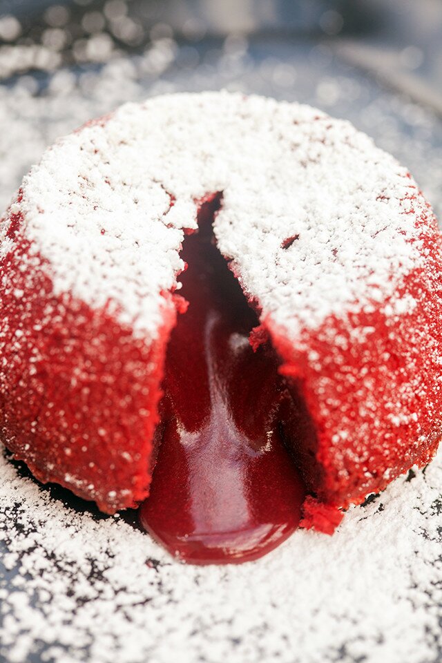 Beautiful red velvet cakes that hide a rich molten center---the most perfect Valentine's Day dessert! | www.spachethespatula.com #recipe