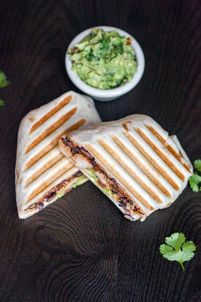 You can use any white fish in these flavorful, simple burritos, packed with cilantro-lime rice, and black beans cooked in tomato juice! | www.spachethespatula.com #recipe