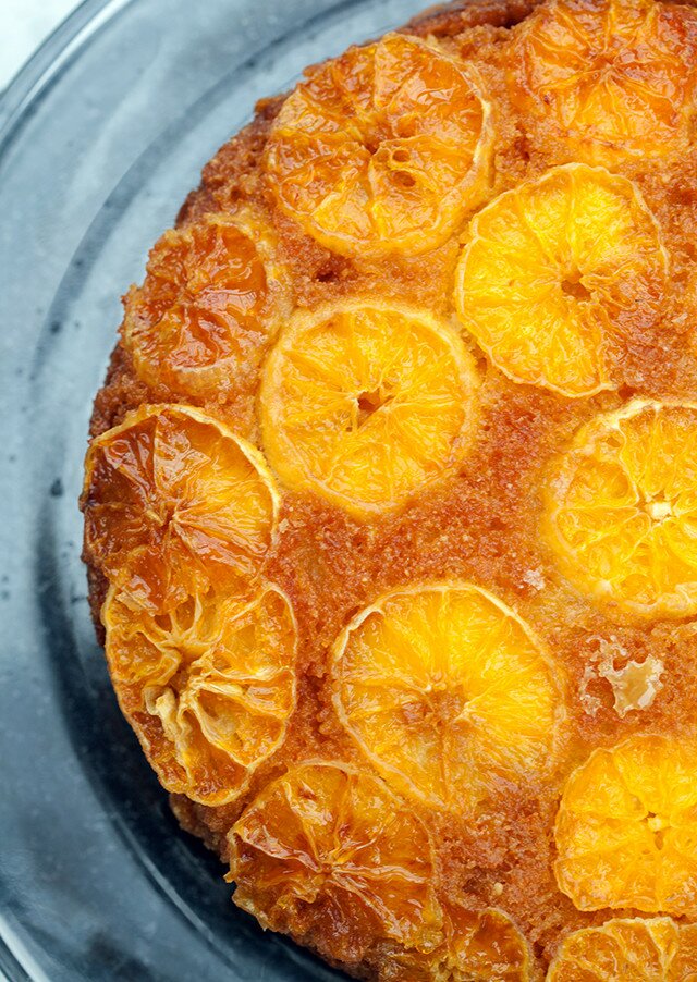 This moist and fluffy cake has a crunchy toasted cinnamon almond base, and a gooey tangelo and caramel top---it’s outrageously tasty as dessert, or breakfast! | www.spachethespatula.com #recipe