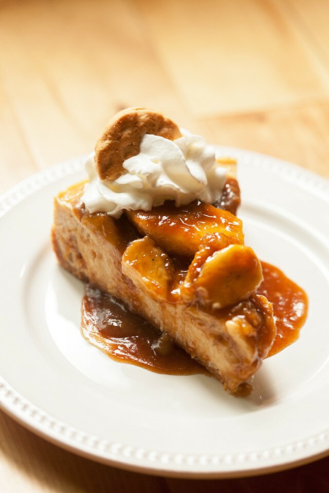 A Do-Si-Do Girl Scout cookie base, a peanut butter & banana cheesecake filling, and a bananas foster topping...it doesn't get any better than this folks! | www.spachethespatula.com #recipe