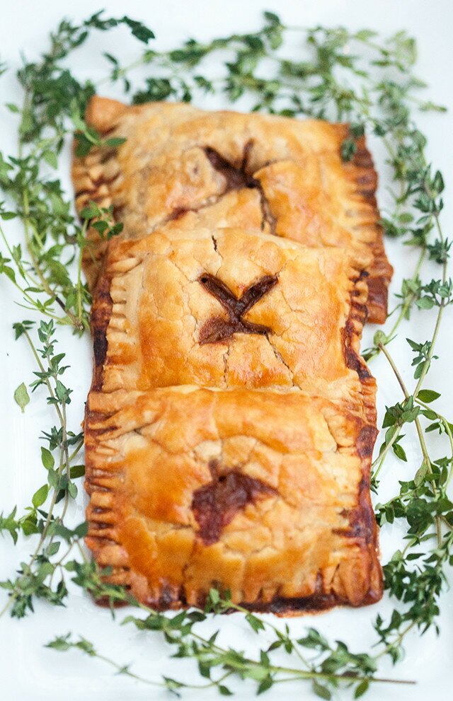 Buttery, flakey hand pies filled with the best beef and Guinness beer filling! Perfect for St. Patrick's Day! | www.spachethespatula.com #recipe