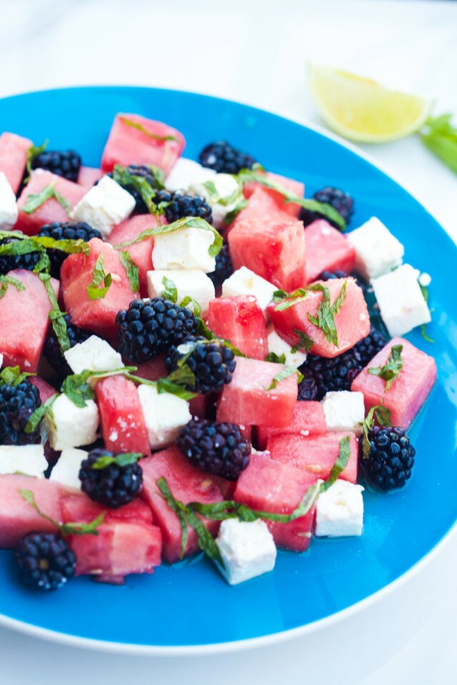 Refreshing fruit, salty feta, and tangy-sweet dressing---this is a perfect salad for warmer weather! | www.spachethespatula.com #recipe