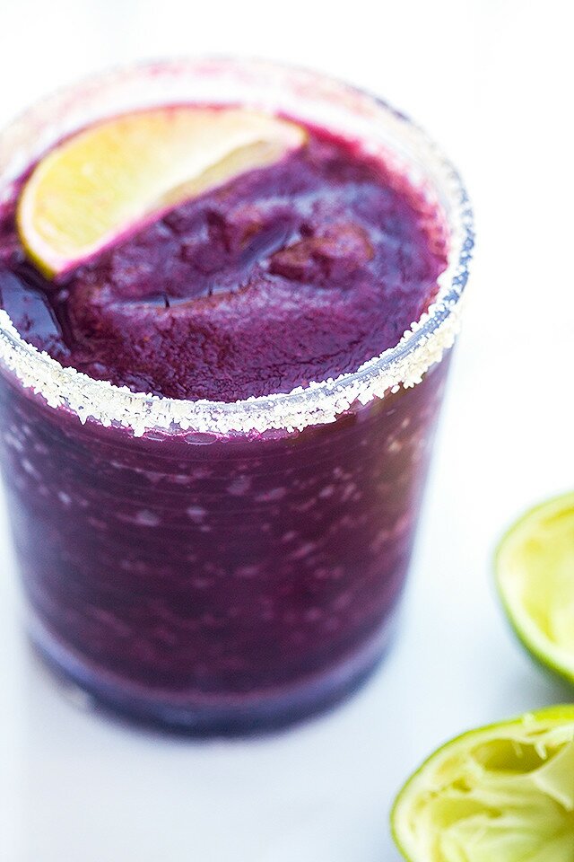 Blueberries, lime, and just a touch of agave combine for a gorgeous and delicious margarita! | www.spachethespatula.com #recipe
