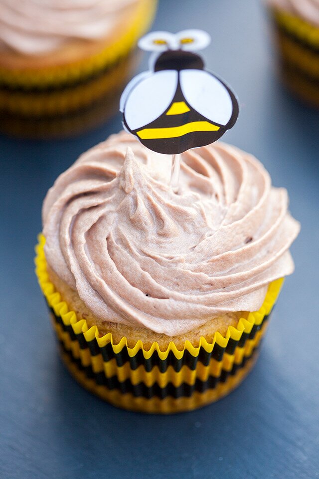 Moist and delicious banana cake topped with a soft and fluffy Nutella cream cheese buttercream---the BEST use for brown bananas! | www.spachethespatula.com #recipe