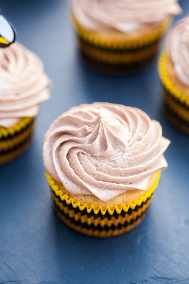 Moist and delicious banana cake topped with a soft and fluffy Nutella cream cheese buttercream---the BEST use for brown bananas! | www.spachethespatula.com #recipe