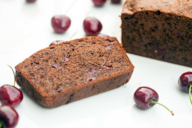 A dense, rich, and chocolatey pound cake, studded with pieces of fresh, juicy cherries! | www.spachethespatula.com #recipe