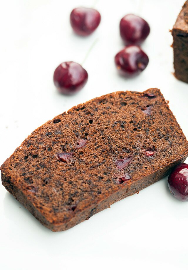 A dense, rich, and chocolatey pound cake, studded with pieces of fresh, juicy cherries! | www.spachethespatula.com #recipe