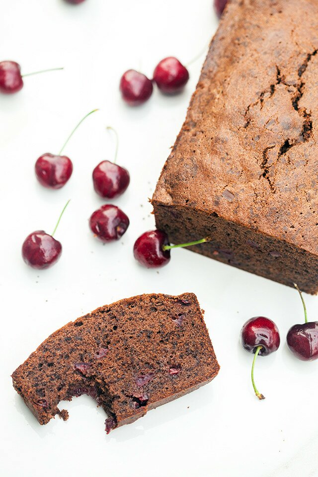 A dense, rich, and chocolatey pound cake, studded with pieces of fresh, juicy cherries! | www.spachethespatula.com #recipe