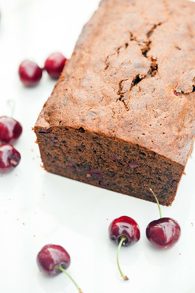 A dense, rich, and chocolatey pound cake, studded with pieces of fresh, juicy cherries! | www.spachethespatula.com #recipe