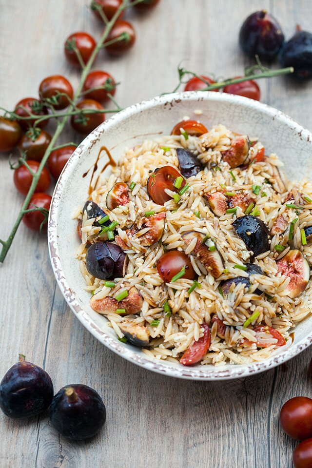 Juicy tomatoes, sweet figs, bold blue cheese, fresh herbs, and crunchy walnuts come together with a sticky drizzle of balsamic glaze, to create a Summer picnic, pasta salad masterpiece. | www.spachethespatula.com #recipe