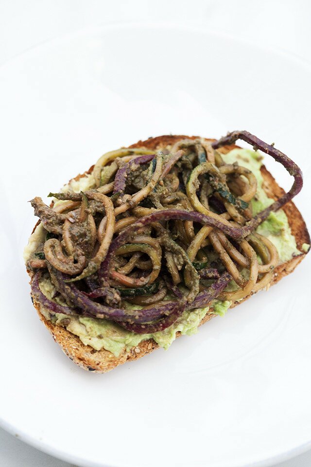 Zucchini and beet noodles tossed in a super flavorful pesto---this salad/noodle dish is so super tasty! #vegan | www.spachethespatula.com #recipe